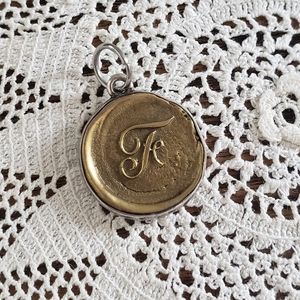 Waxing poetic insignia charm F